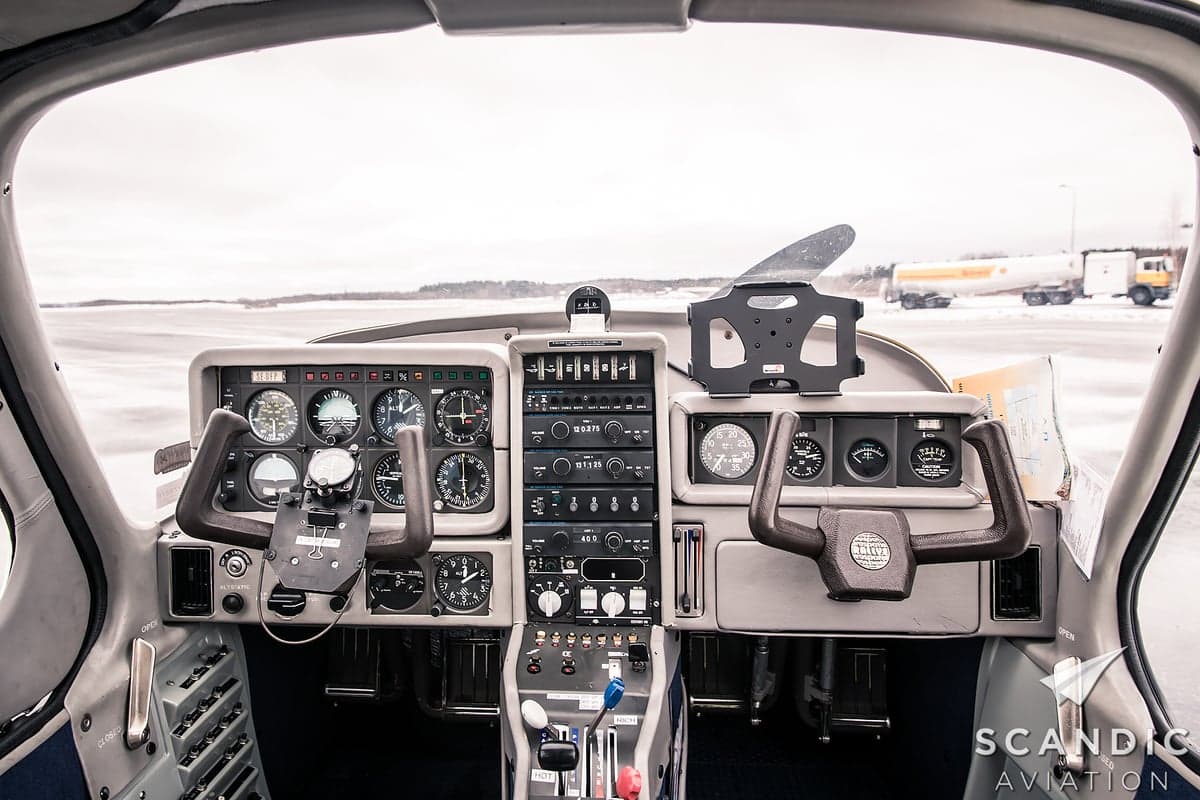 The cockpit of an aircraft with various instruments and controls.
