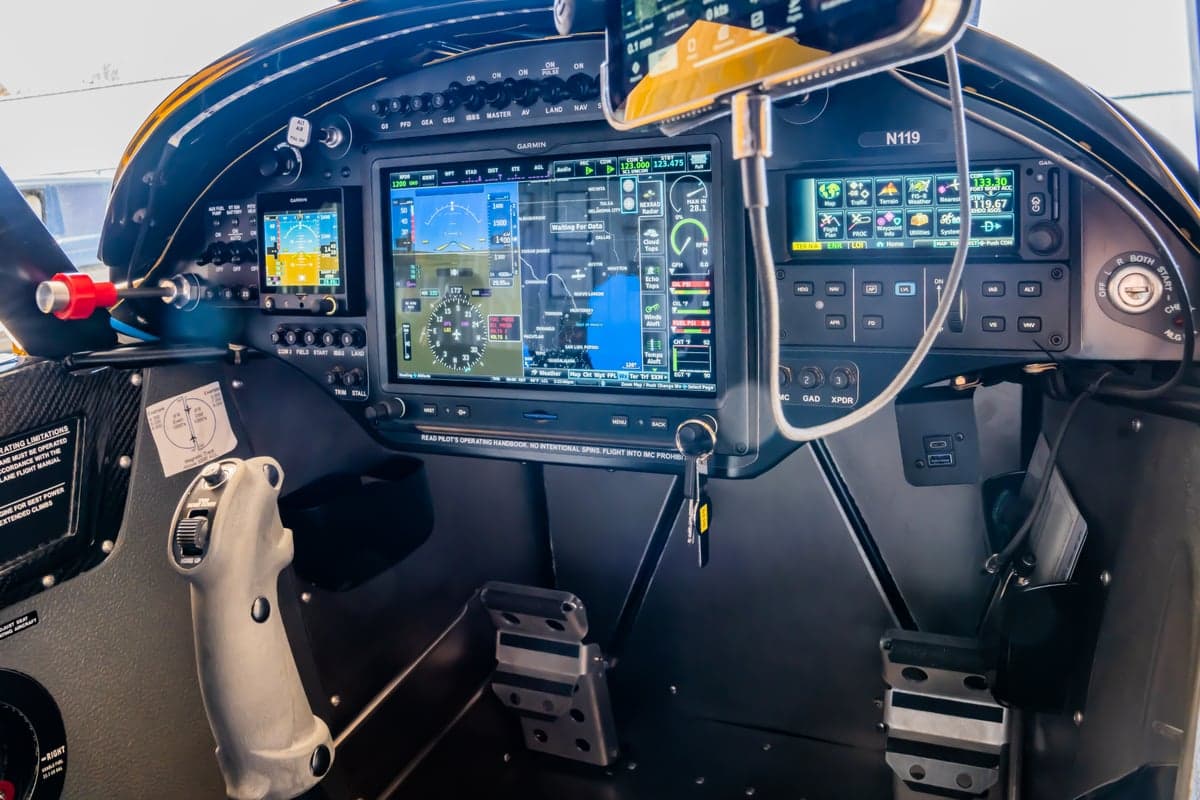 NX Cub cockpit instrument panel with Garmin avionics.