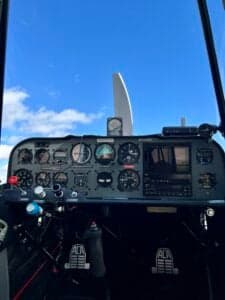 The instrument panel of an ACA aircraft with various gauges and controls.