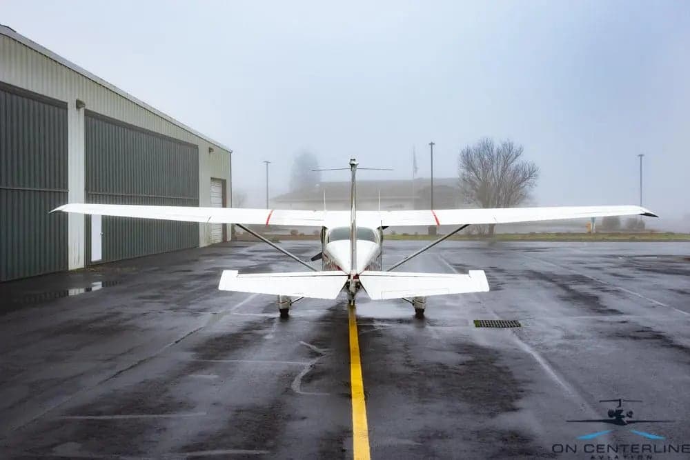 Rear view of a Cessna 172 Skyhawk parked on the tarmac.