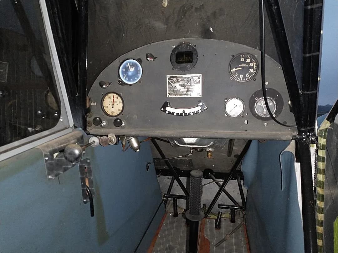 The instrument panel of an aircraft cockpit, featuring various gauges and controls.