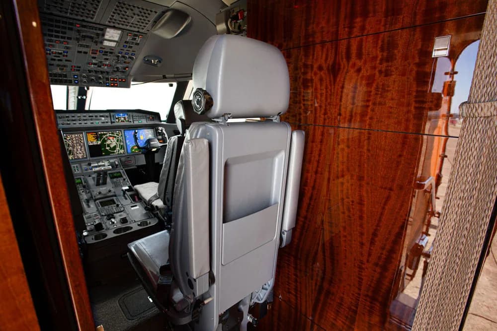 View of the cockpit from behind the pilot's seat.