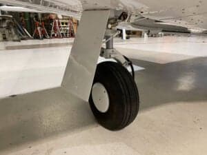 Close-up of the landing gear and wheel of N2247M.