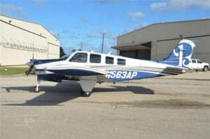N563AP Bonanza aircraft parked on the tarmac, side view.