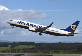 A Ryanair Boeing 737 taking off from a runway.