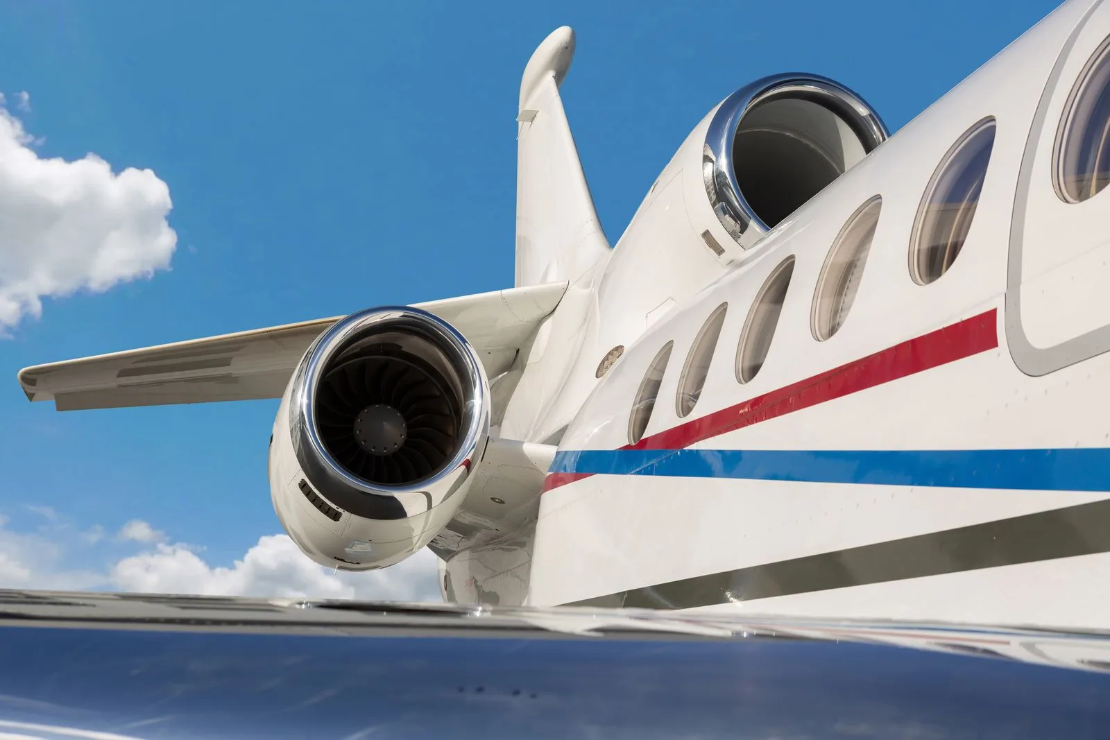 Close up of the tail and engine of a Falcon jet.
