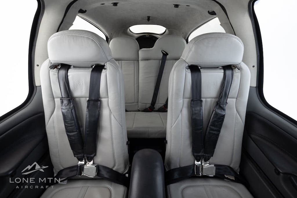 View of the Cirrus SR22T cabin showing the front and rear seats.