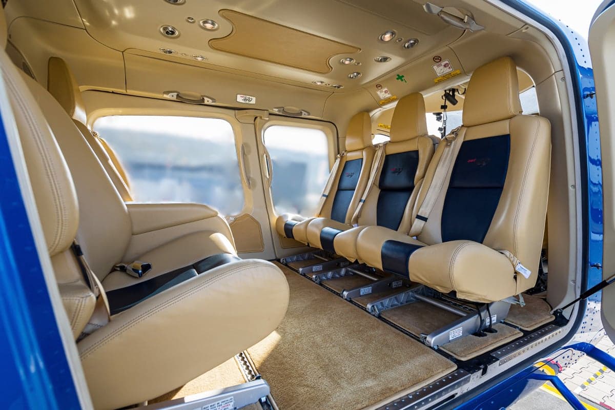 The interior of the Bell 429 helicopter with tan leather seats.