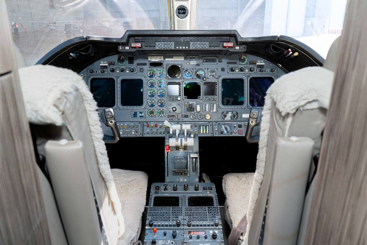 The instrument panel and controls in the cockpit of the aircraft.