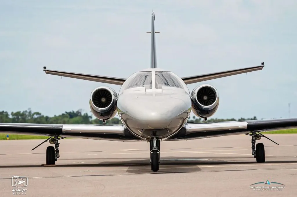 A head-on view of the N15JT Cessna Citation X business jet parked on an airfield.