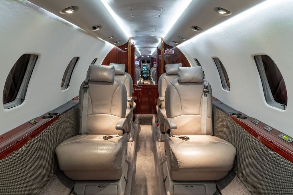 Interior of a Cessna Citation CJ3+ aircraft, showing the seating arrangement.