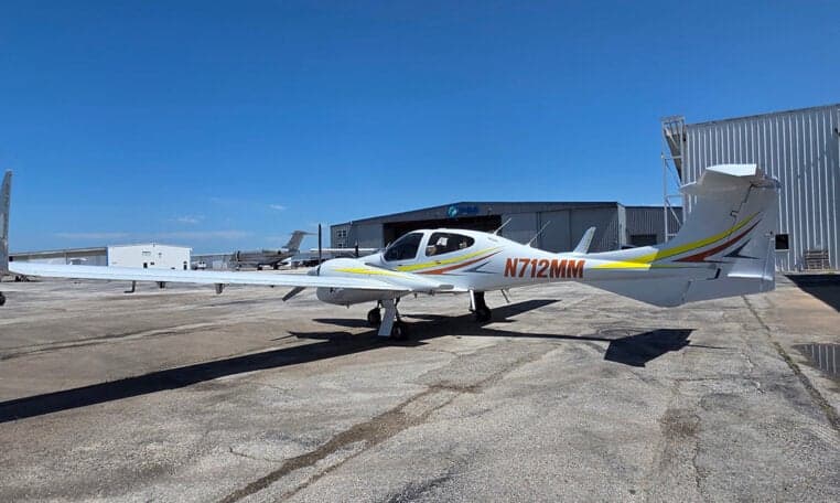 Side view of the Diamond DA62 aircraft with tail number N712MM.