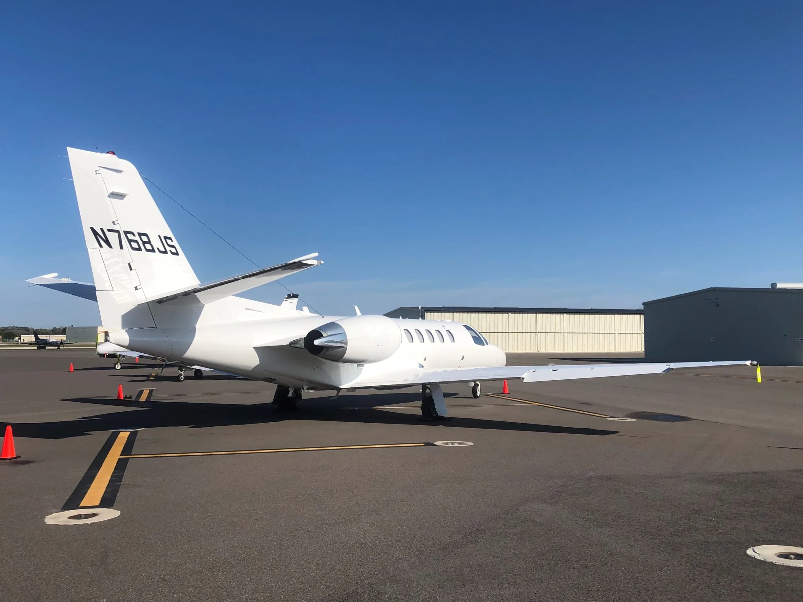 White Cessna Citation CJ3 on the tarmac, rear view.