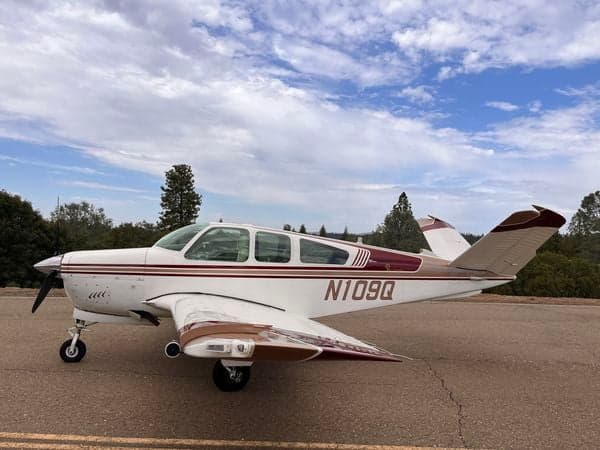 Side view of the N109Q aircraft on the ground.