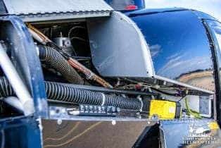 Close-up of the engine compartment of the Robinson R44 helicopter.