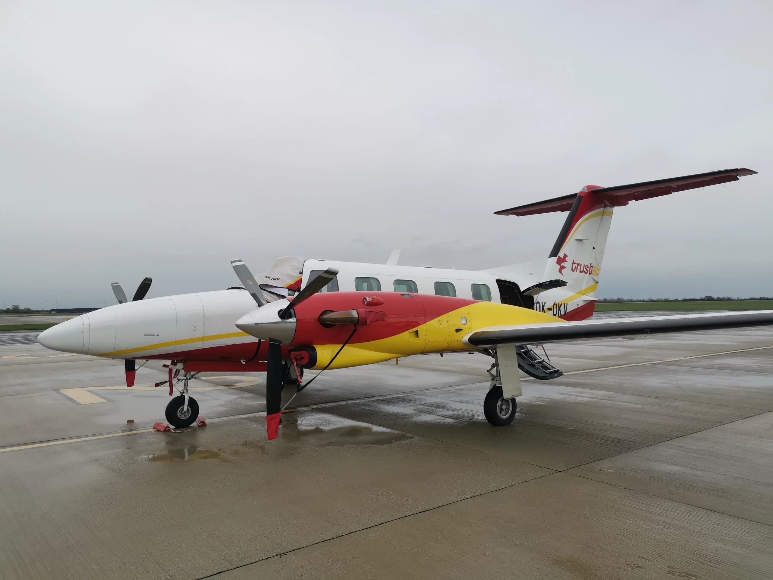 OK-OKV Cheyenne III aircraft with Trust Air livery parked on the tarmac.