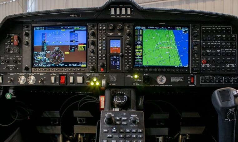 The instrument panel of a Diamond DA62 aircraft with Garmin avionics.