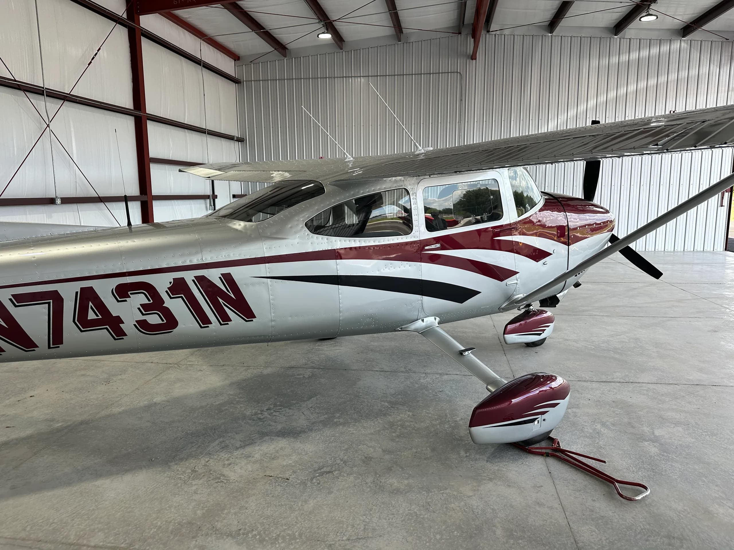 Close-up of the Cessna 182 Skylane N7431N nose and wing root.