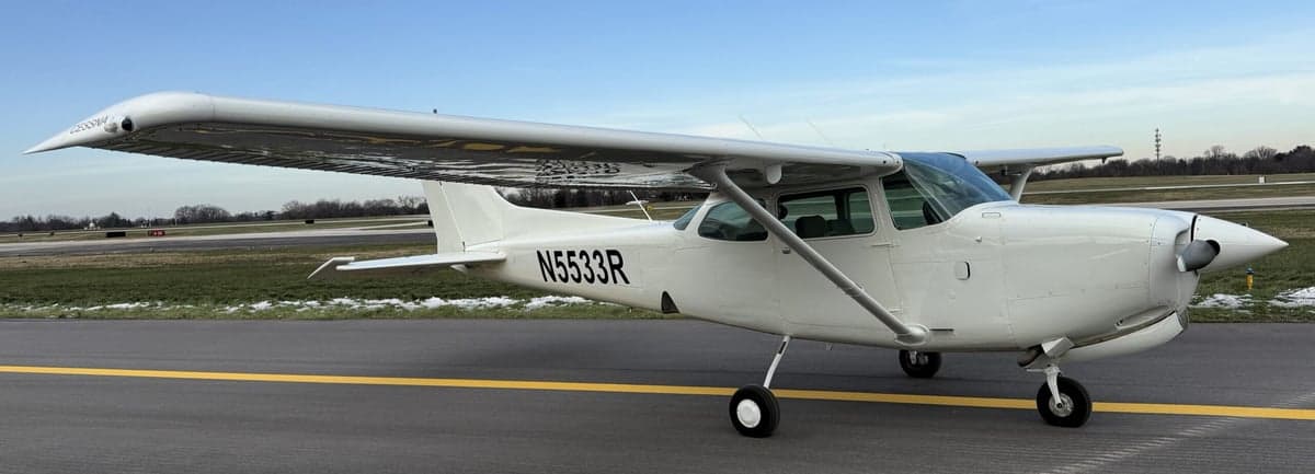 A Cessna 172 aircraft with tail number N5533R parked on the tarmac.