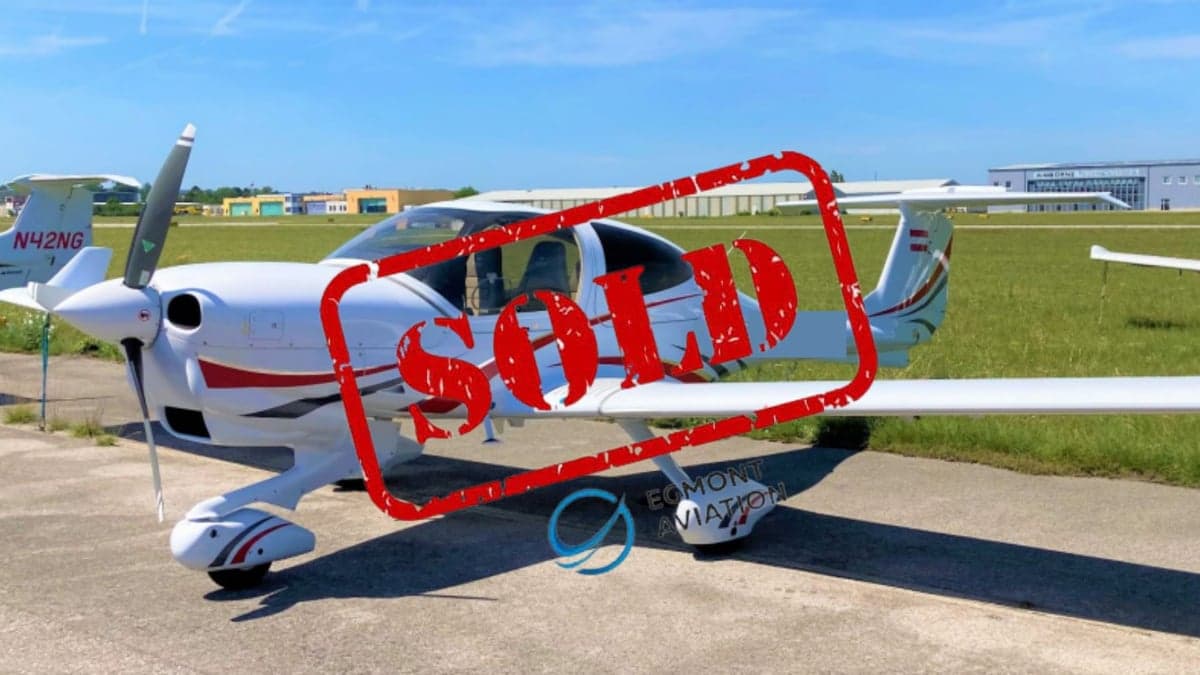Diamond DA40 aircraft with red and white paint scheme on the tarmac, with a SOLD overlay.