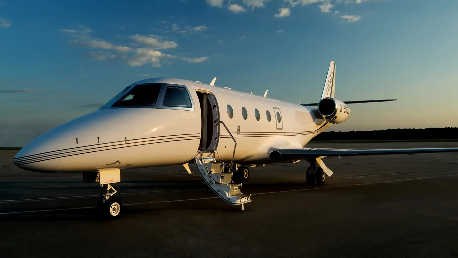 Gulfstream G150 on the tarmac with the door open.