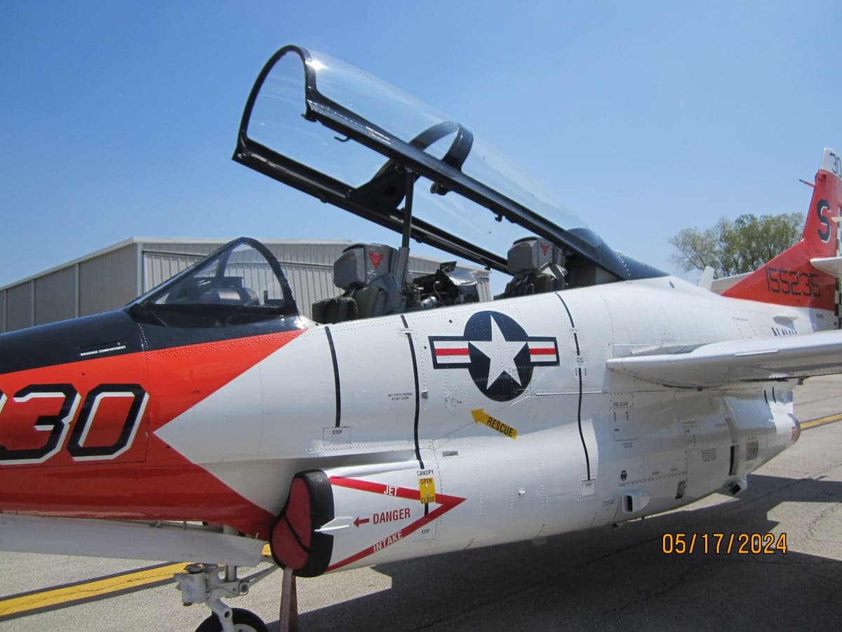 Close-up of the T-2B Buckeye aircraft's cockpit and side markings.