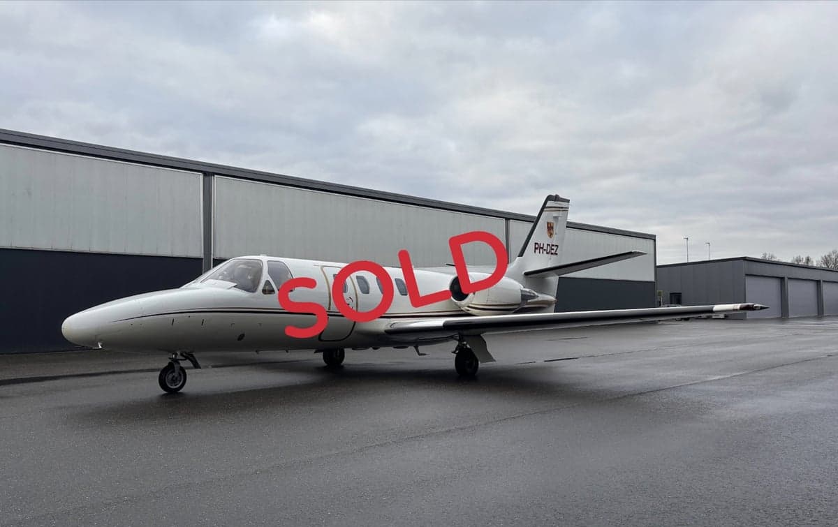 A Cessna Citation CJ1 aircraft with registration PH-DEZ parked on the tarmac, with a 'SOLD' overlay.