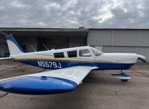 Side view of the N5579J aircraft on the tarmac.