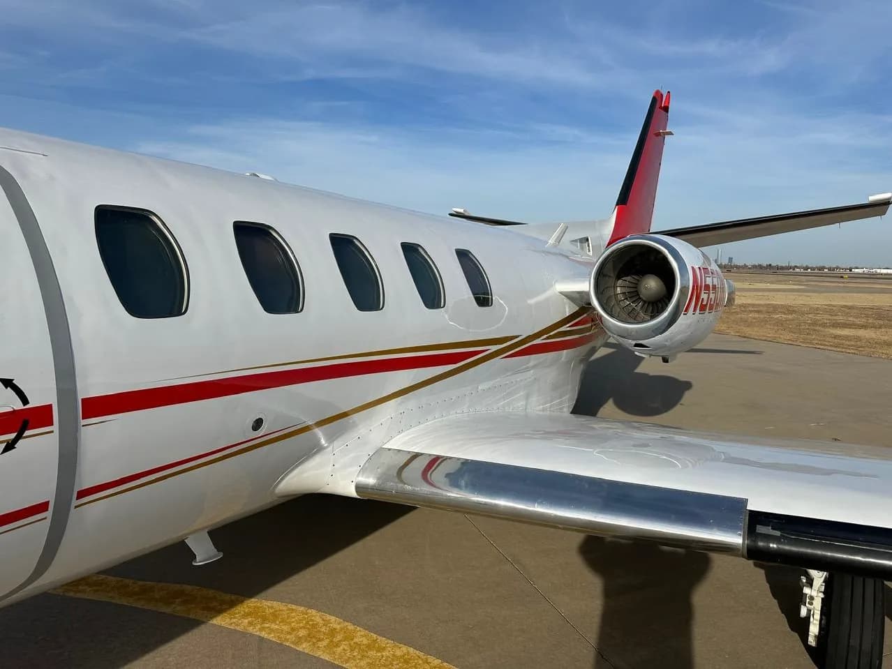 Close-up of the engine and windows of Cessna Citation CJ1+ aircraft N550NT.