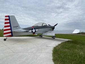 Side view of the N194PT aircraft with red, white, and blue tail markings.