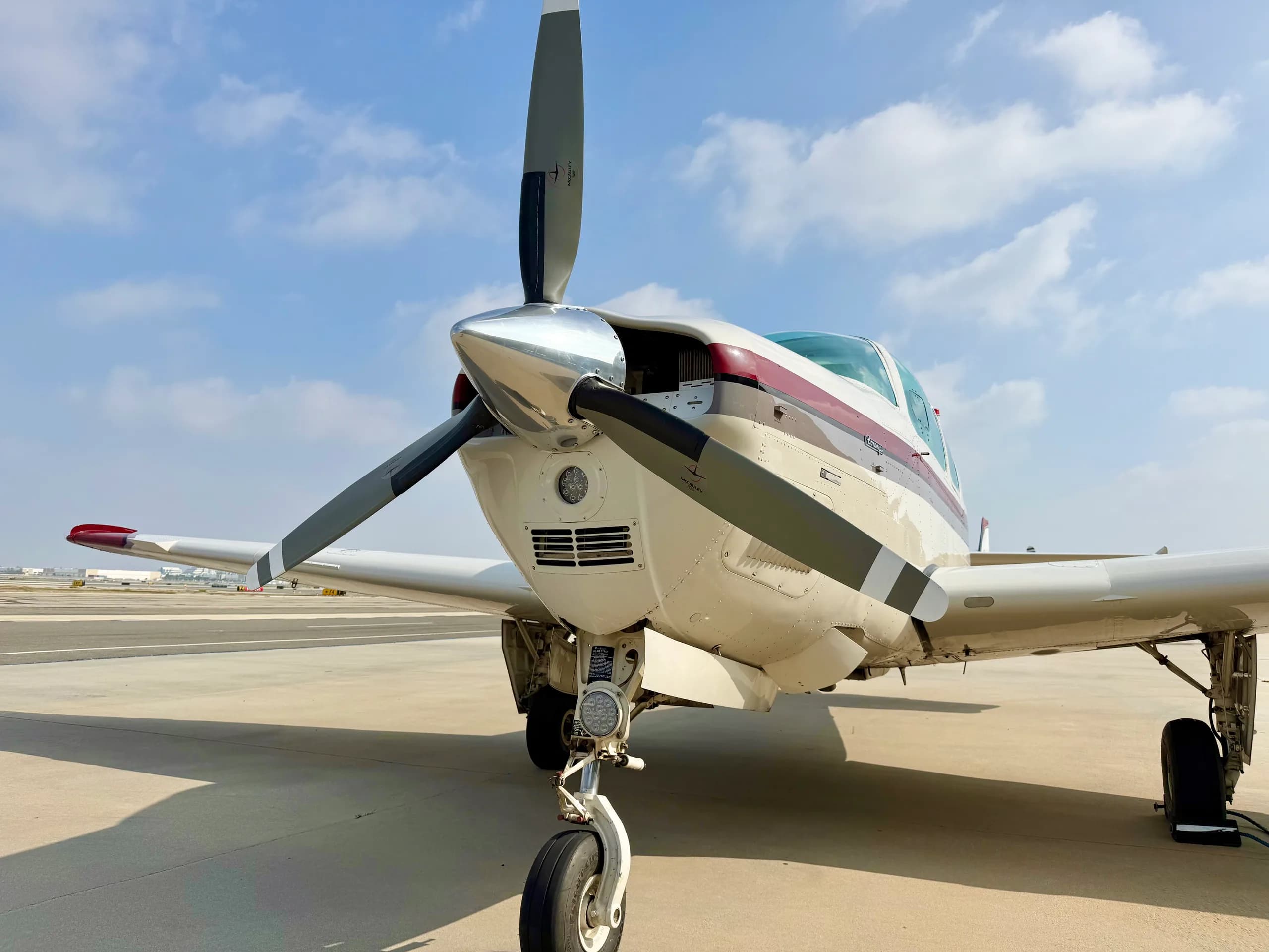 Front view of a Beechcraft Bonanza N3228W on the tarmac.