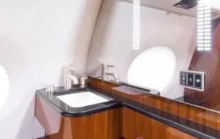 A lavatory sink and vanity inside the aircraft.