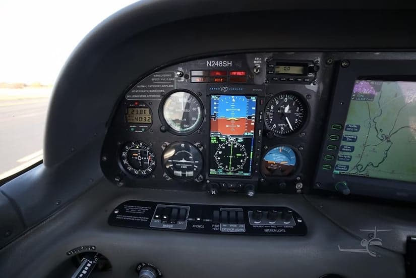 The cockpit instrument panel of a Cirrus SR22 aircraft, featuring various gauges and displays.