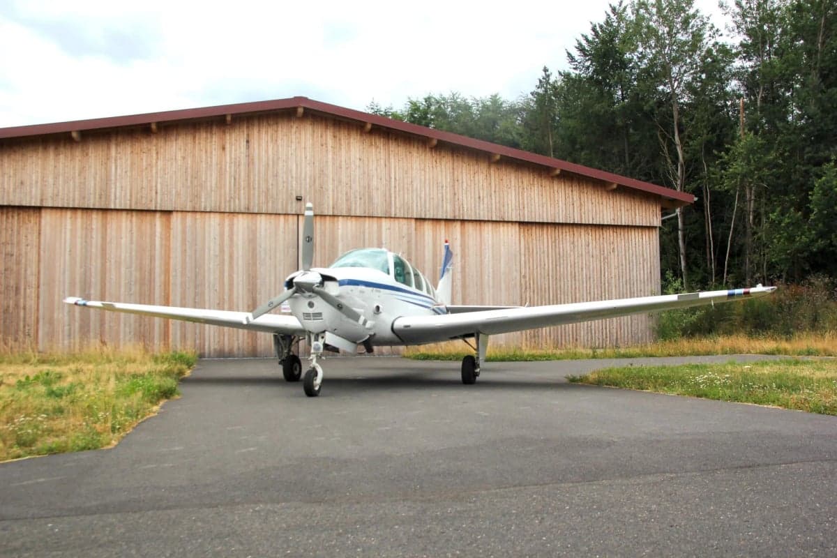 Front view of N225CR Beechcraft Bonanza parked on the tarmac.