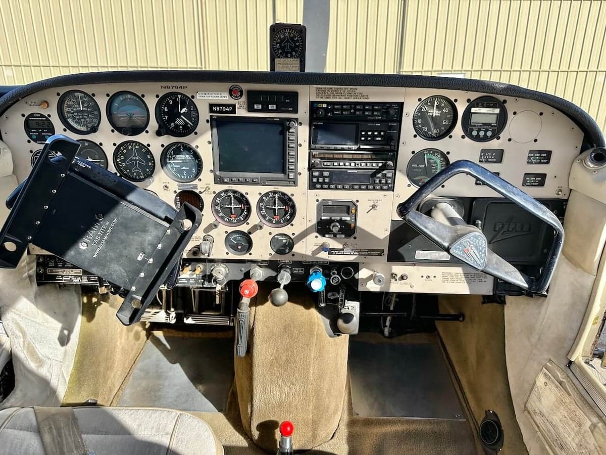 View of the aircraft's instrument panel and control yoke.