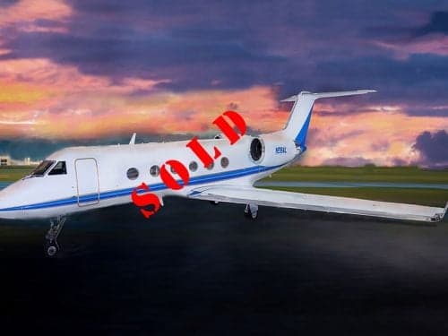 A Gulfstream aircraft with registration N68AL is parked on the tarmac with a sunset background, marked with a 'SOLD' overlay.