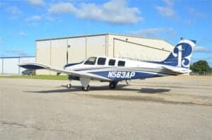 N563AP Bonanza aircraft parked on the tarmac, side view.