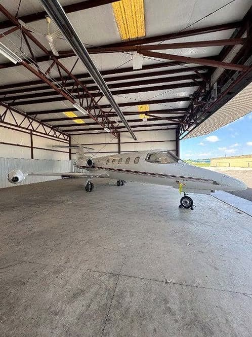 A Learjet 35A in a hangar.
