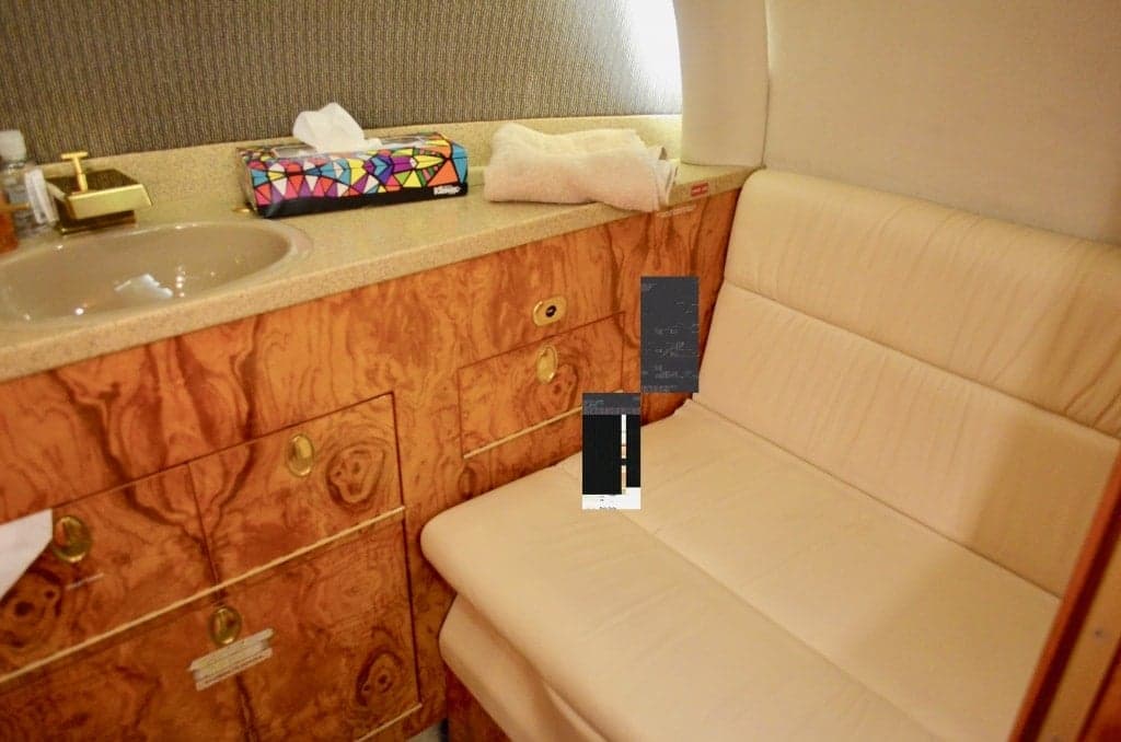 Interior of the aircraft with a leather seat and sink.