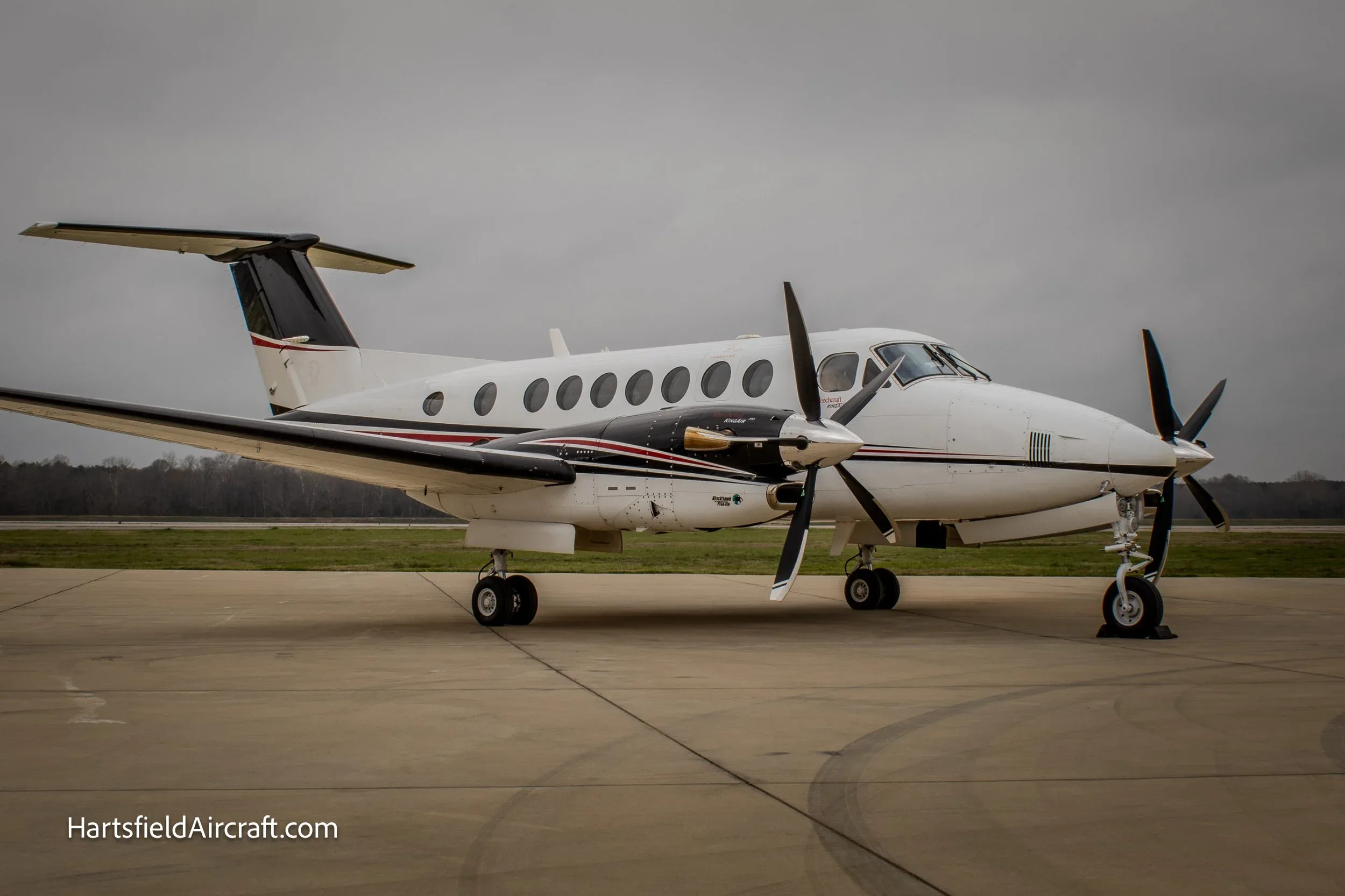 Side view of a King Air 360 on the tarmac.