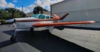 Side view of the N210R aircraft on the ground.