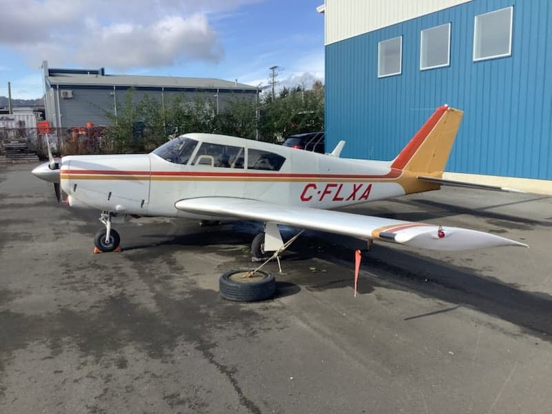 Side view of the C-FLXA aircraft on the ground.