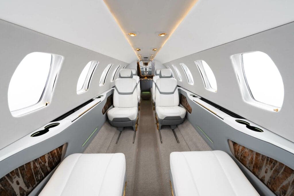 A view of the Citation CJ3 cabin interior with white leather seats.