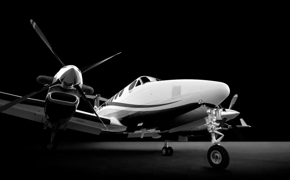 A King Air turboprop aircraft in a studio setting.