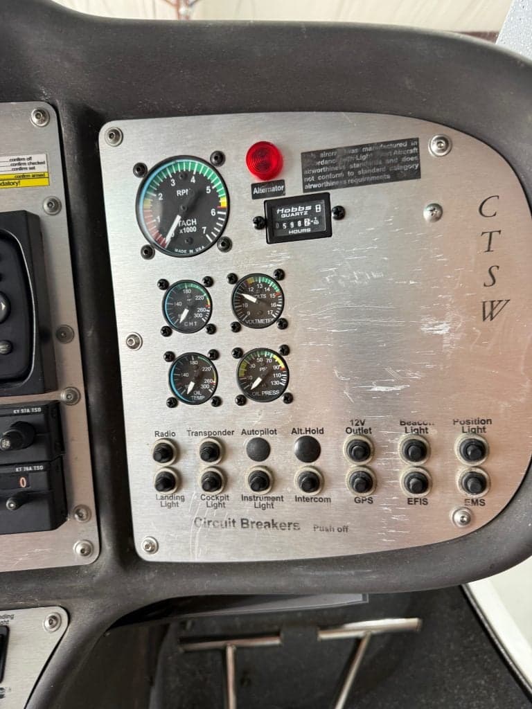 Close-up of the CTLSW aircraft's instrument panel, showing various gauges and switches.