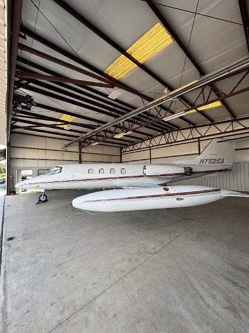 A Learjet 35A with tail number N752EA in a hangar.