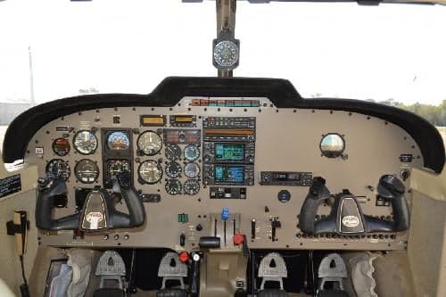 The cockpit of the aircraft features a full instrument panel and control yokes.