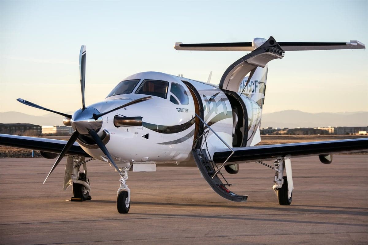 Pilatus PC-12 on the ramp with open door.