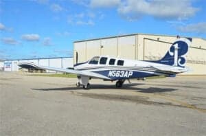 N563AP Bonanza aircraft parked on the tarmac, side view.