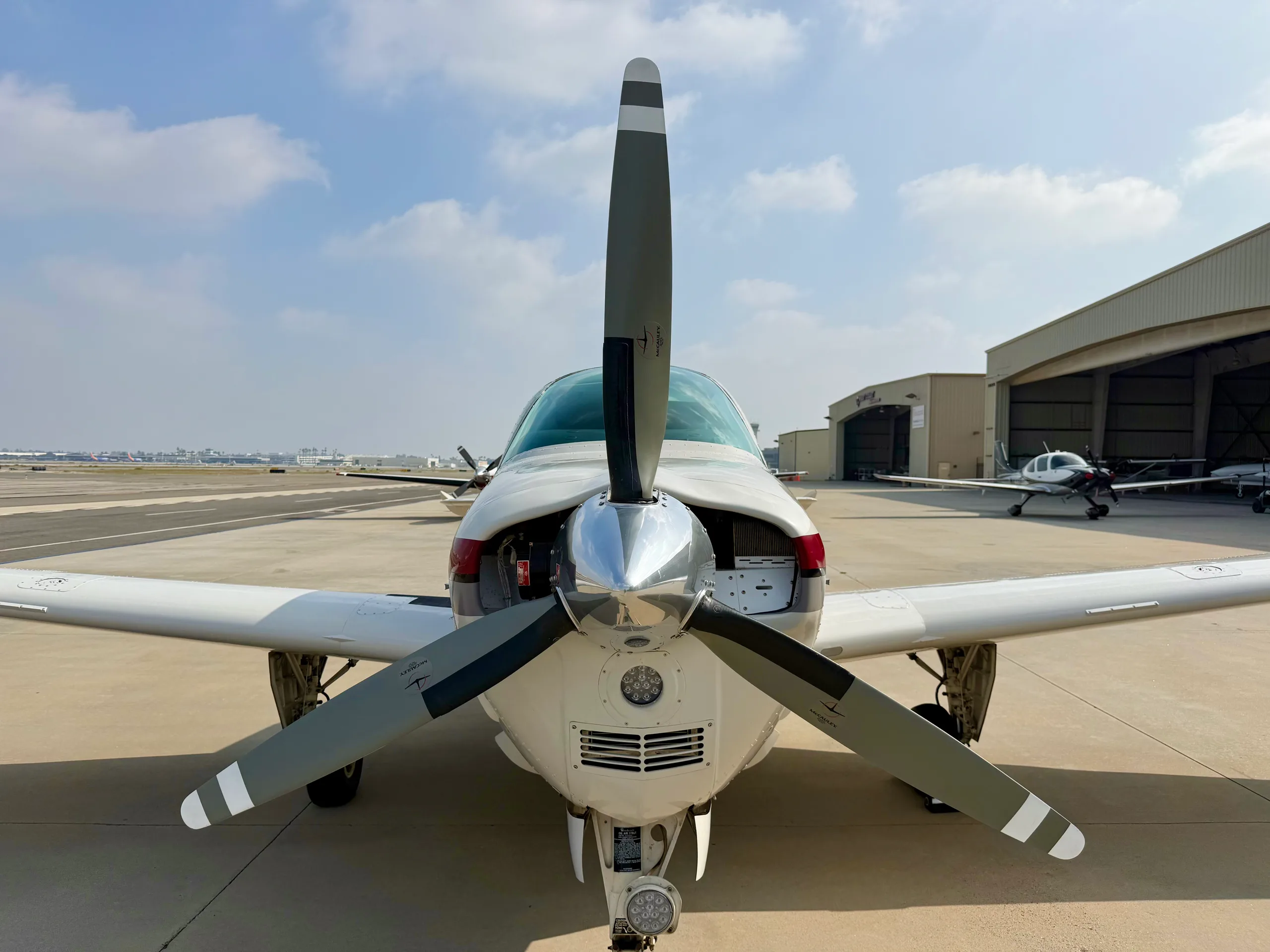 Close up front view of a Beechcraft Bonanza N3228W on the tarmac.